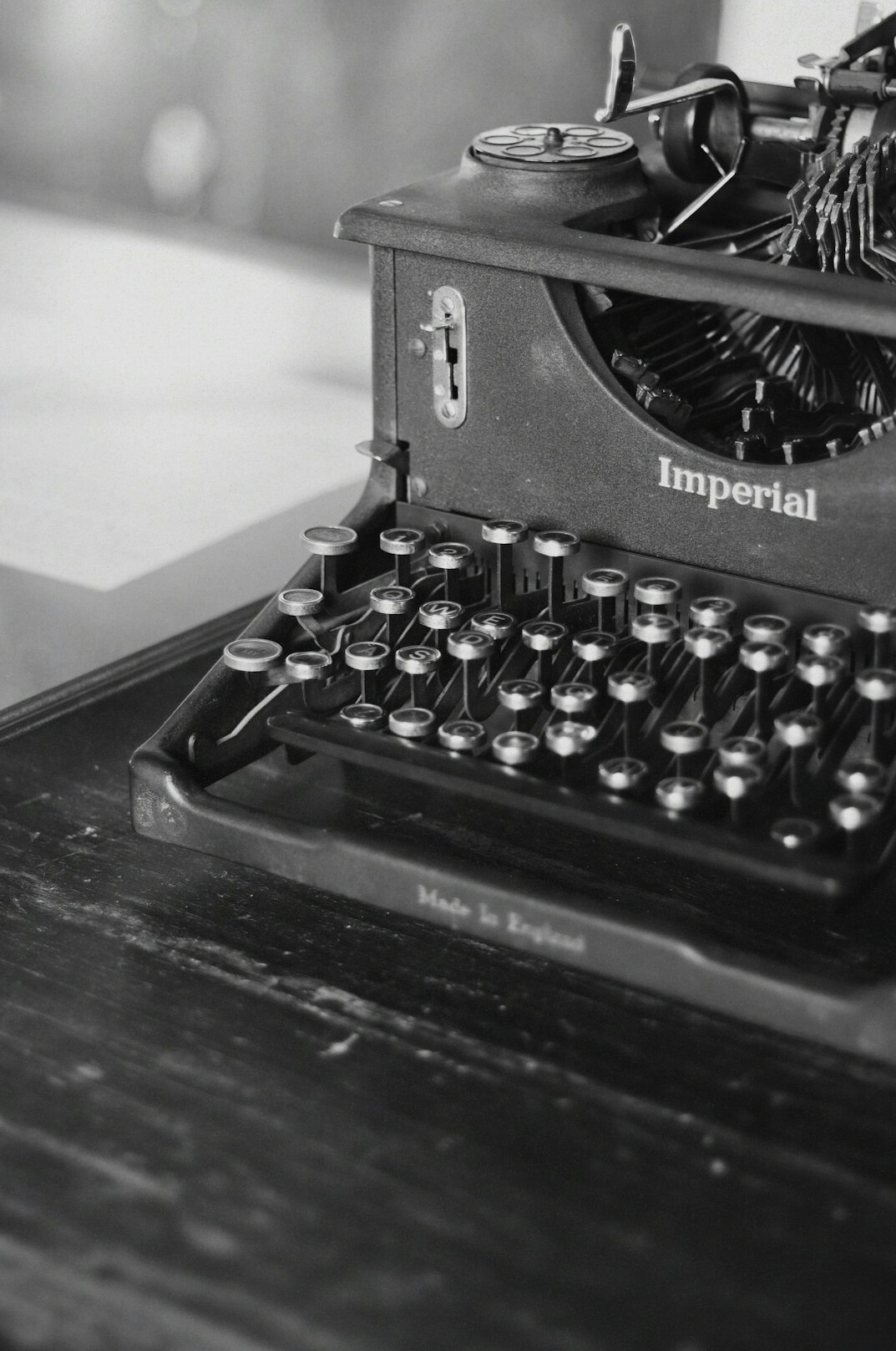 Vintage typewriter on a desk with paper