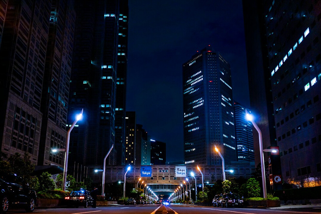 City street at night with lit buildings