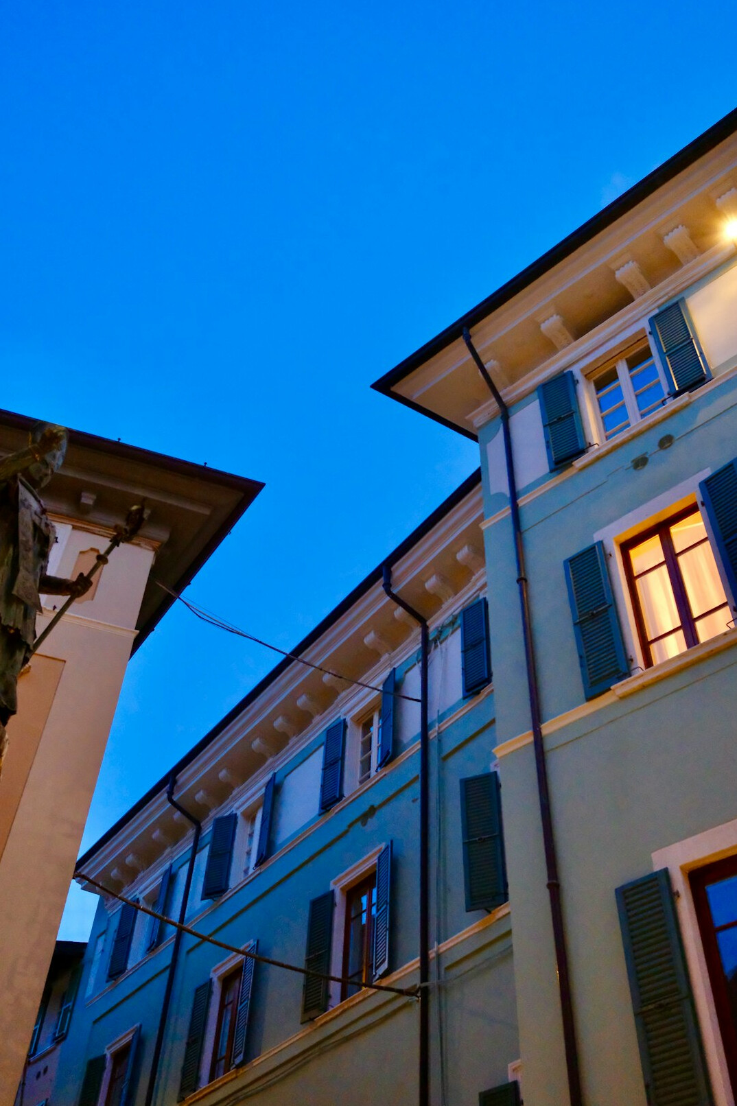 European city street with old buildings at dusk