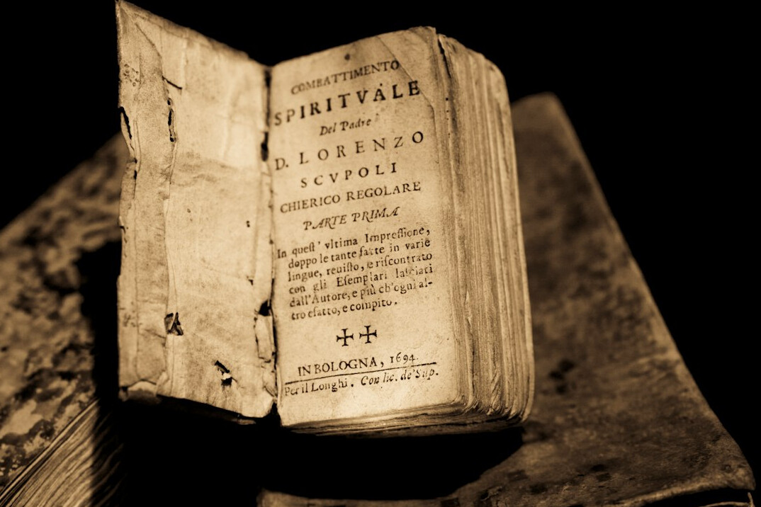 Open antique book with aged pages