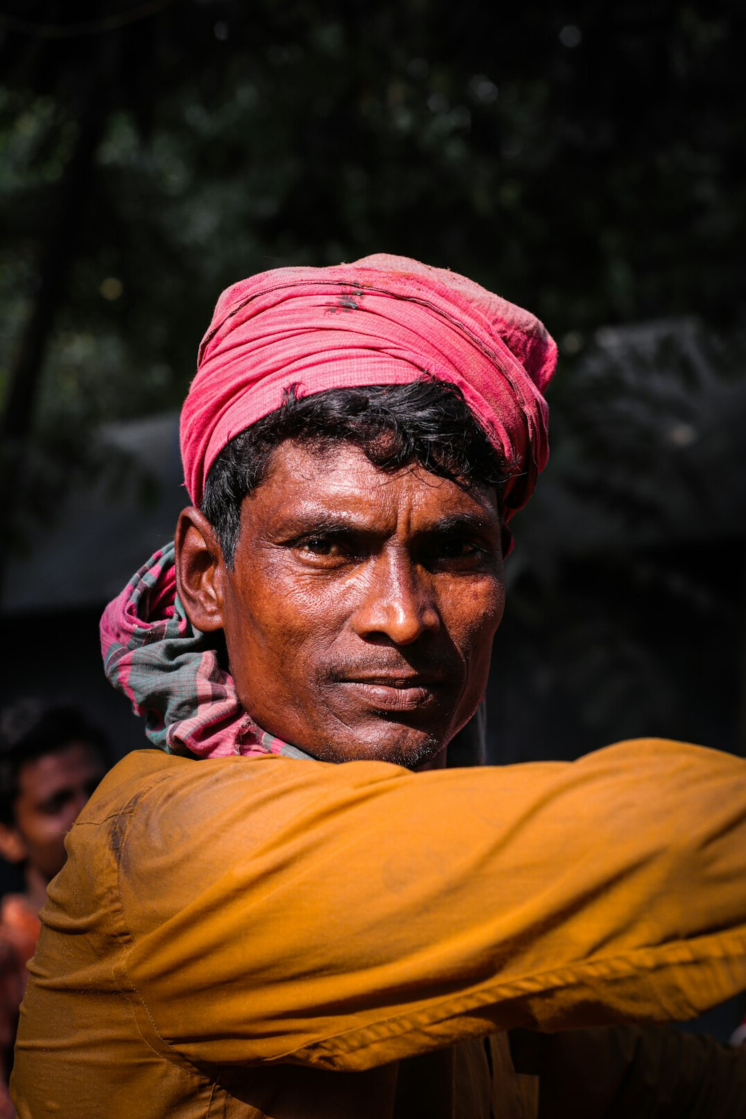 Portrait of a man in a shirt looking at the camera